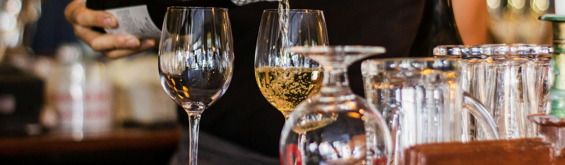 Wine being poured at the bar